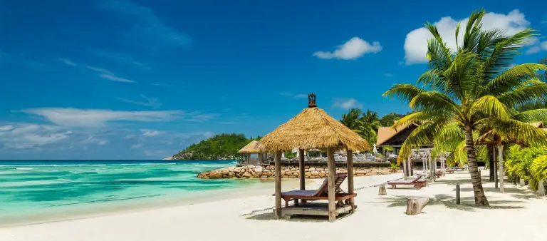 beach beds with roof and turquoise sea